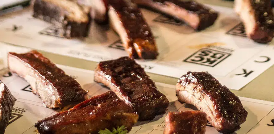 Your Guide to the BBQ, Blues, Brews & Bourbon Festival Barbecue Competition Meat Being Judged